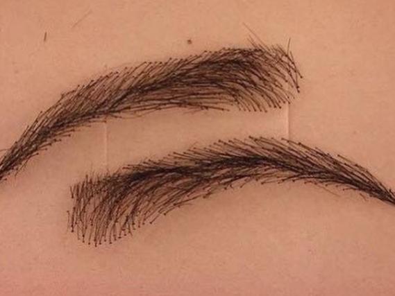 The eybrow wig sticks over brows to make them look fuller.