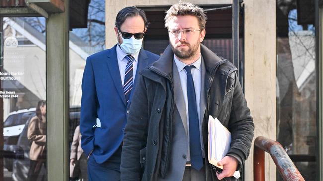 Teacher Matthew Corey Schulz, left, leaves Mount Barker Magistrates Court behind his lawyer. Picture: Brenton Edwards