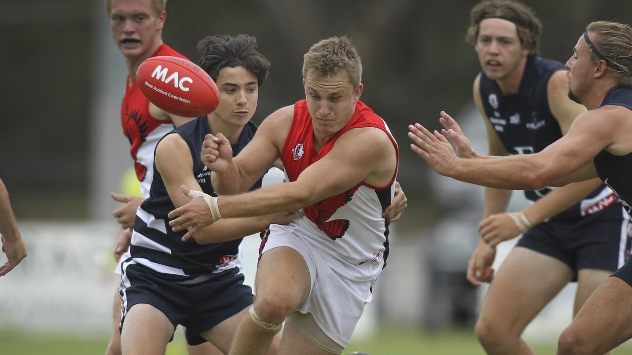 Southern Football League: Noarlunga v Flagstaff Hill. Flagstaff Hill's Bradley Patterson under pressure from Noarlunga's Hayden Case-Peach. 13 April 2019. (AAP Image/Dean Martin)