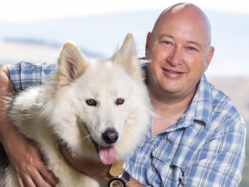 EMBARGO SUNDAY FEBRUARY 2nd 2020: Australia's Best Friend Campaign. #australiasbestfriendMatt at his home with his service dog Ulric, a Lykos. Ulric is off duty when at home but always sticks close to Matt and loves to play.Matt was an investigator with the ADF. He was deployed to the Middle East on a couple of occasions and investigated the deaths of soldiers. He developed severe PTSD through what he investigated and saw. The PTSD only manifested itself after he injured his back and was no longer able to work - when there was nothing keeping him busy his trauma floated to the surface. His service dog Ulric has saved his life - literally. He says the dog stopped him from killing himself on two occasions. On an everyday level, the dog is there to sense his anxiety and get him out of situations that could be bad for him. He wants to get the message across the service these dogs perform, and how they should be treated in public (ie, if you see a dog with a "Service Dog" jacket, you pretend it's not there, don't go patting it).   Picture: Sarah Matray