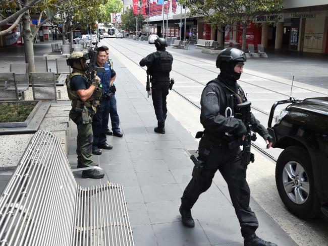 The normally bustling Bourke Street Mall closed off by police. Picture: Lawrence Pinder