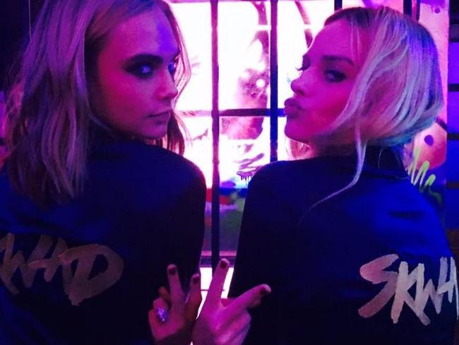 Cara Delevigne and Margot Robbie twinning in matching tracksuits at the Suicide Squad after party in London. Picture: Instagram