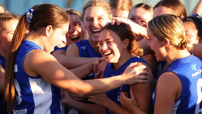 PERTH, AUSTRALIA - JULY 15: East Fremantle players celebrate Zipporah Fish of the Sharks winning best on ground during the WAFLW Grand Final match between Claremont and East Fremantle at Mineral Resources Park on July 15, 2023 in Perth, Australia. (Photo by James Worsfold/Getty Images)