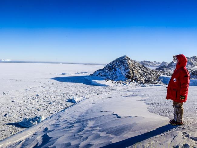 Australian Antarctic Division. Expeditioner looks over Vanderford Glacier near Casey research station, 2015 (photo © Gordon Tait/Australian Antarctic Division)