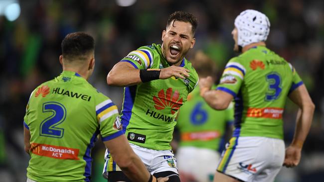 Aiden Sezer of the Raiders celebrates with teammates after kicking a last minute field goal during the Round 12 NRL match between the Canberra Raiders and the Manly-Warringah Sea Eagles at GIO Stadium in Canberra, Friday, May 25, 2018. (AAP Image/Lukas Coch) NO ARCHIVING, EDITORIAL USE ONLY