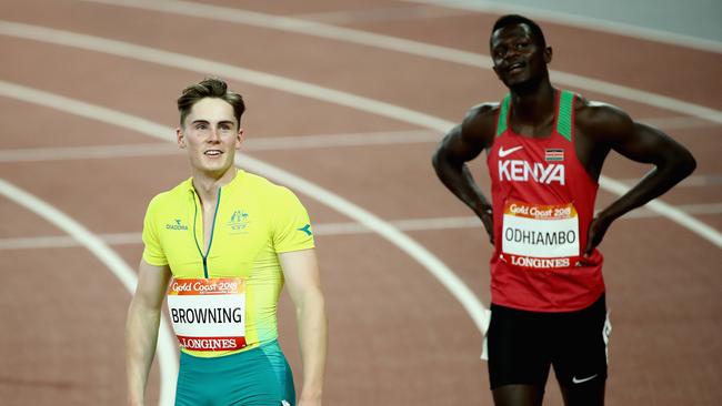 Rohan Browning of Australia and Mark Otieno Odhiambo of Kenya look on after the Men's 100 metres semi finals at the 2018 Commonwealth Games. Picture: Cameron Spencer/Getty Images