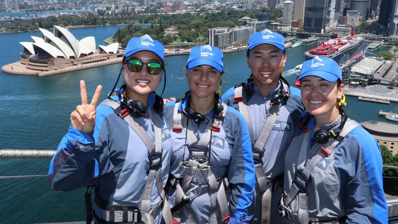 Golfers Minjee Lee, Steph Kyriakou, Min Woo Lee and Hannah Green atop the Sydney Harbour Bridge.