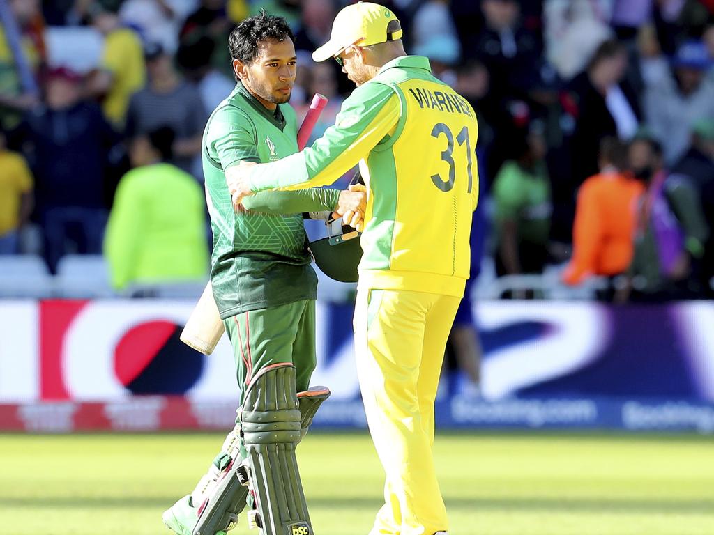 David Warner and Bangladesh's Mushfiqur Rahim after Australia’s win.