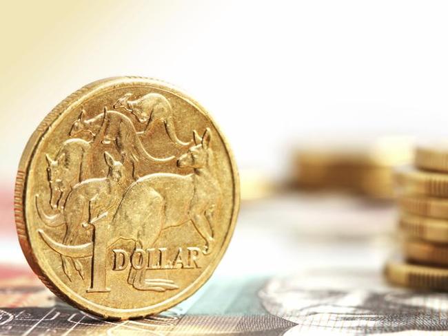 Aussie one dollar coins, on a twenty dollar note.