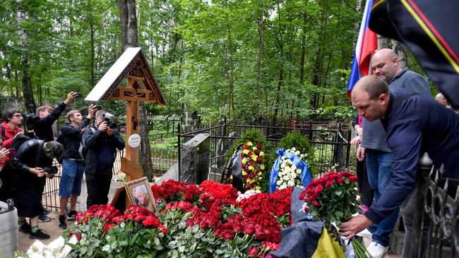 A man lays flowers at the grave of Yevgeny Prigozhin at the Porokhovskoye cemetery in Saint Petersburg last week. Picture: AFP