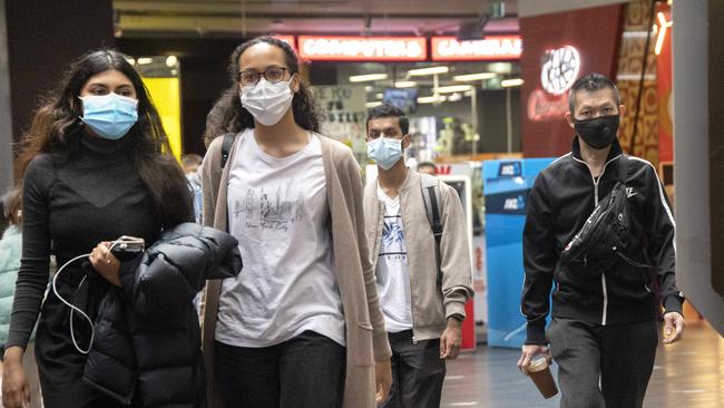 Masks remain mandatory indoors for another fortnight. Picture: NCA NewsWire/David Geraghty