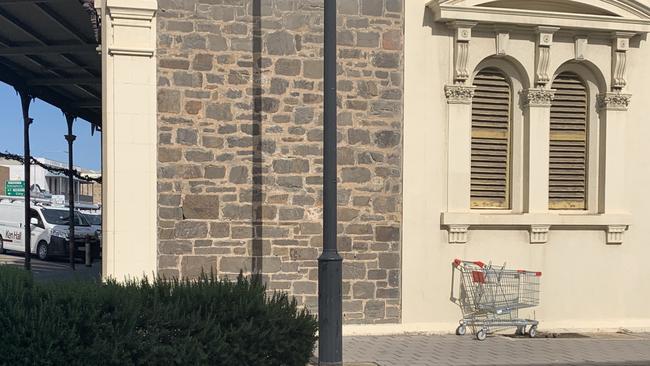 A shopping trolley dumped in a Port Adelaide street. Picture: Paula Thompson