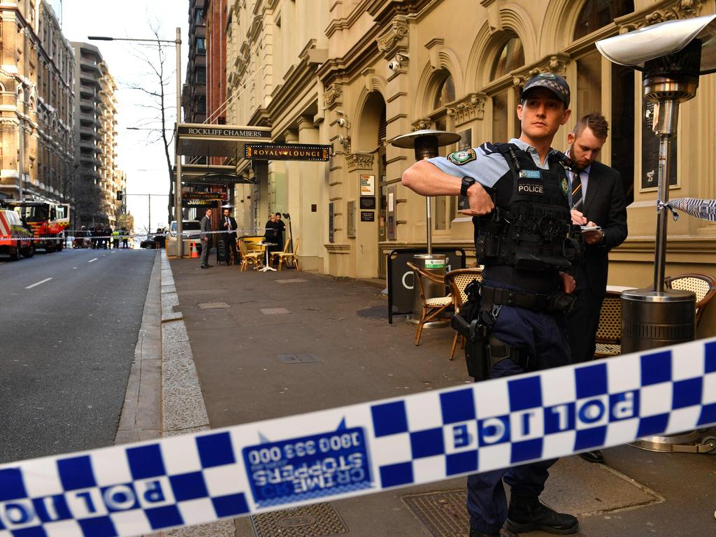 Police gather at the Clarence St apartments. Picture: Saeed Khan/AFP