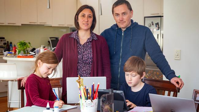 Parents Dave Longmuir and Amelia Teng are juggling working from home and the remote schooling of kids Roy, 10, and Iris, 6, during the COVID-19 lockdown. Picture: Mark Stewart