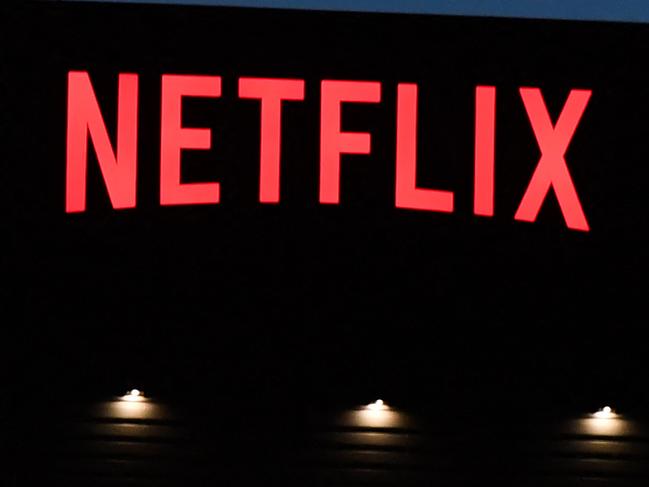 (FILES) In this file photo taken on October 19, 2021 (FILES) In this file photo taken on October 19, 2021, the Netflix logo is seen on the Netflix, Inc. building on Sunset Boulevard in Los Angeles, California. - The comedy satire in which Volodymyr Zelensky unexpectedly becomes Ukraine's president -- his now war-time job in real life -- will be aired again on Netflix, the streaming platform announced March 16, 2022. (Photo by Robyn Beck / AFP)