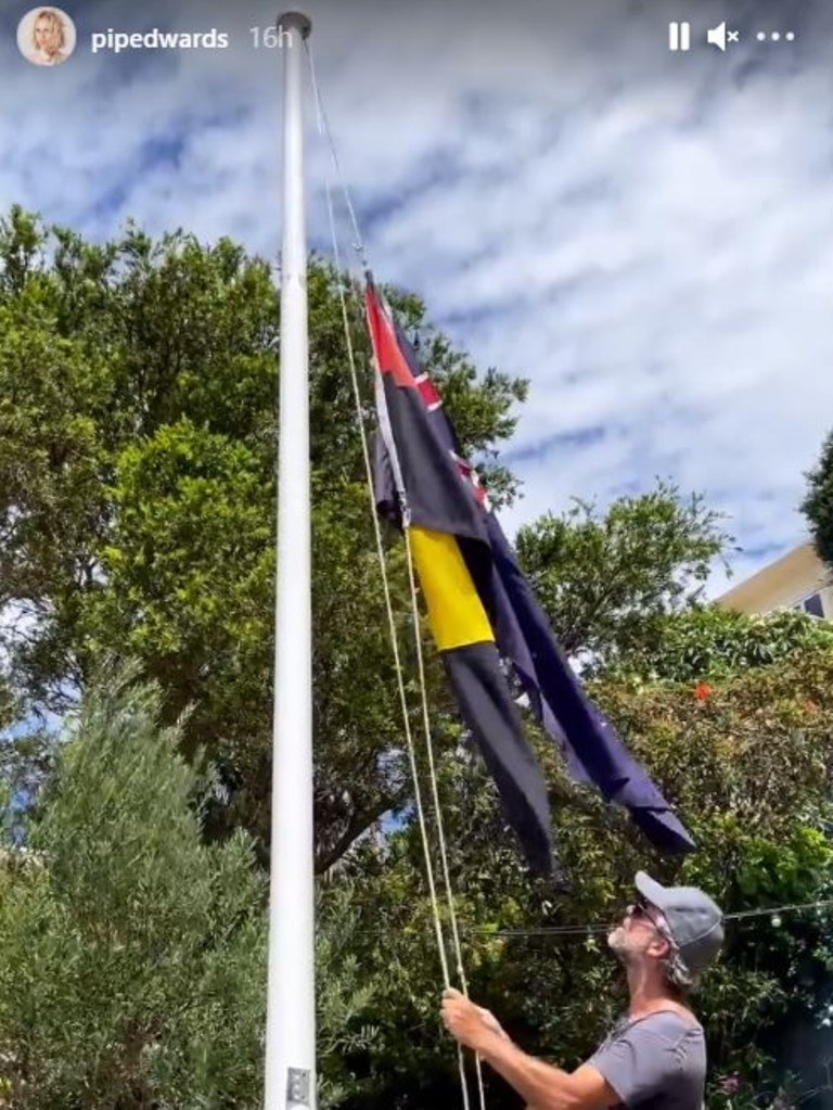 As part of her celebrations her group hung an Aboriginal flag upside down. Picture: Instagram/PipEdwards