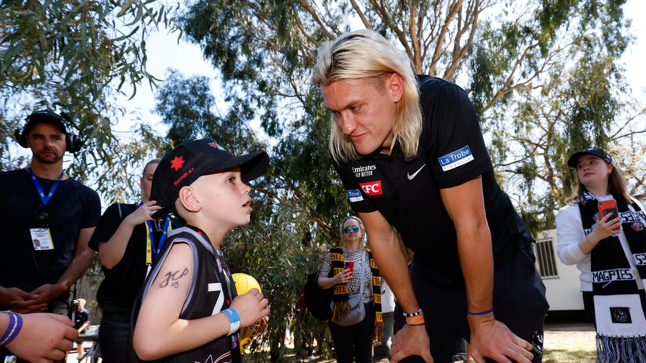 Hunter rushed over to see Darcy Moore — and invite him to his birthday party. Picture: Dylan Burns/AFL Photos via Getty Images