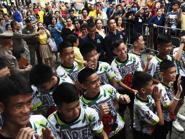 The boys arrived at the media conference to cheers from a crowd outside.