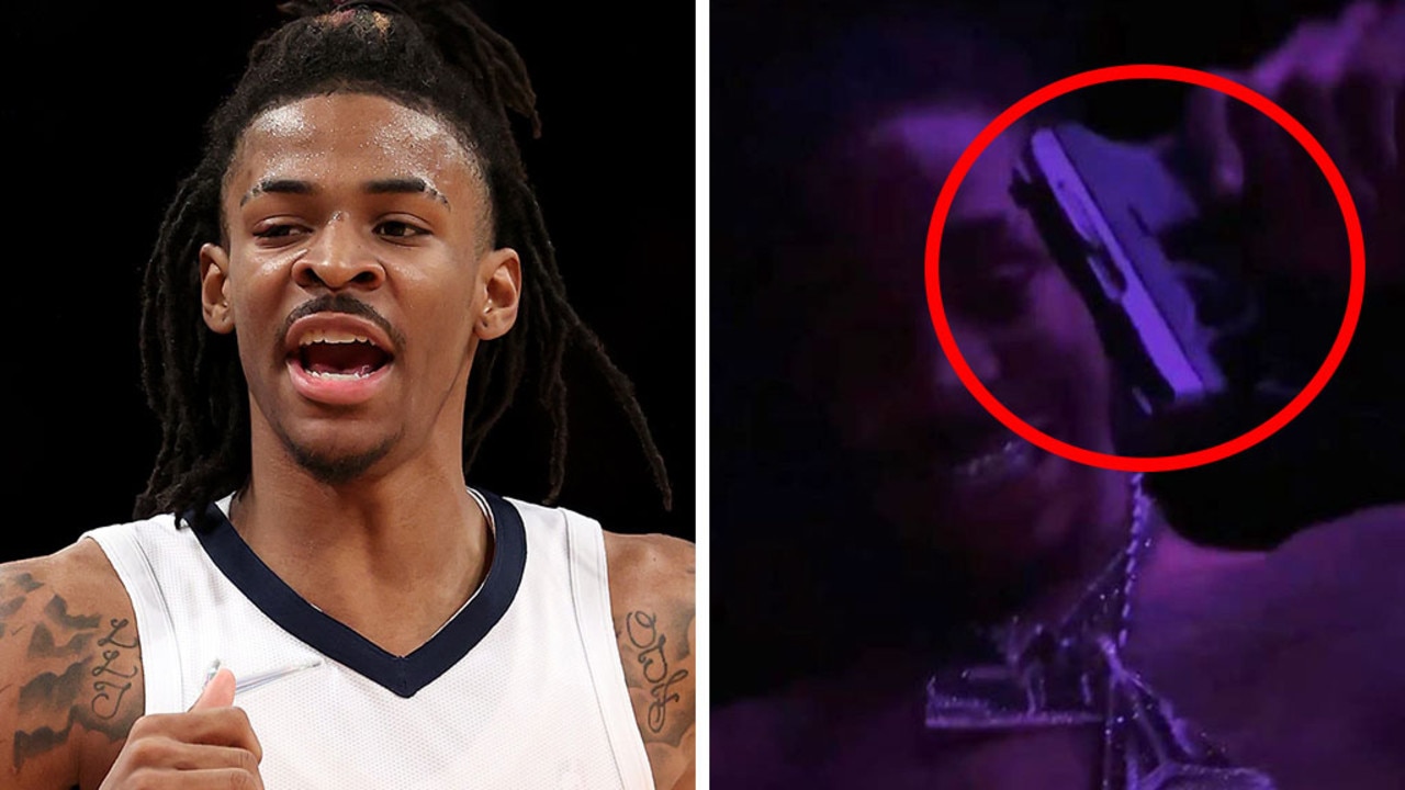 Ja Morant appears to display a gun for a second time at a strip club. Pic: Getty/Instagram