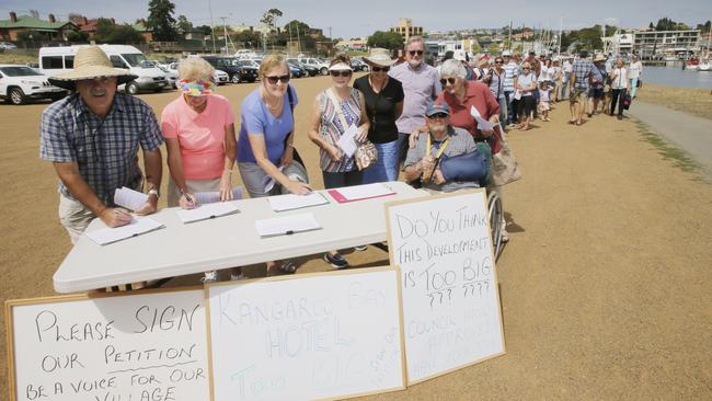 Opponents of a $50 million Kangaroo Bay development sign a petition urging the State Government to intervene. Picture: MATT THOMPSON