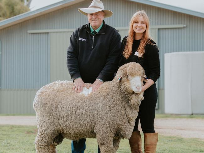 Stephen Chalmers from Nutrien purchased the top priced ram for $5250 on behalf of a client in NSW. He stands with Claire McGauchie of Terrick West Poll Merino stud at Prairie.