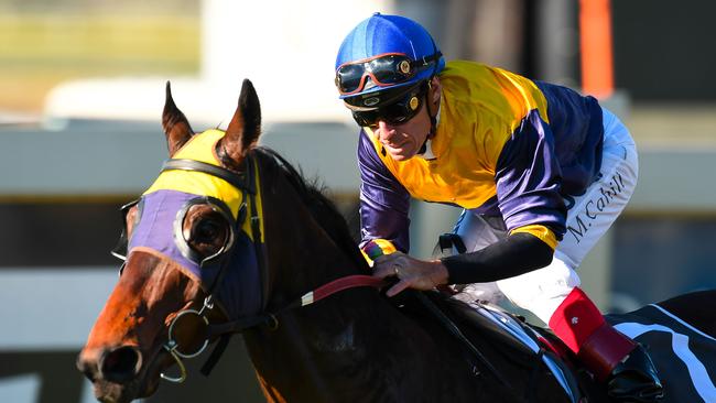 Jockey Michael Cahill rides Alassak to win race 7, the UBET Colts, Geldings and Entires BenchMark 75 Handicap during National Jockey Celebration Day at Doomben Racecourse in Brisbane, Saturday, August 5, 2017. Photo: Albert Perez, AAP.