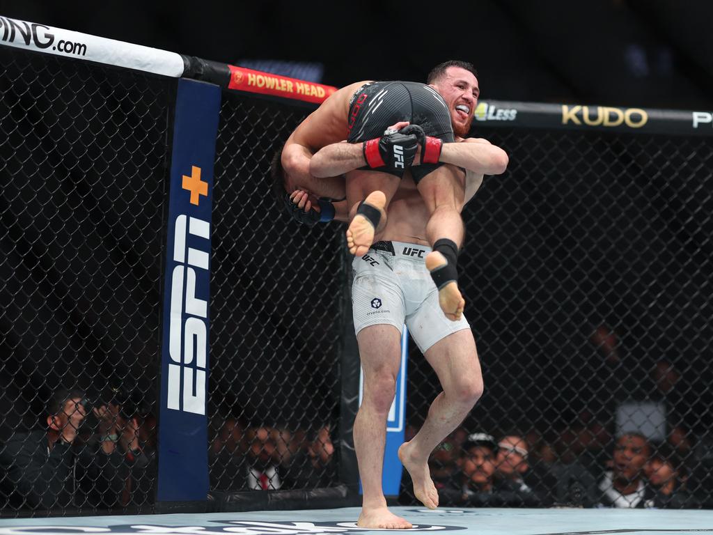 Merab Dvalishvili picks up Henry Cejudo during their bantamweight weight fight at UFC 298. Picture: Getty Images via AFP