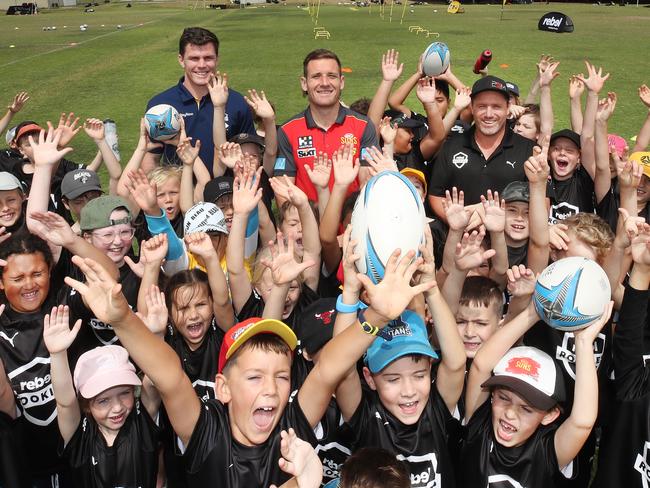 Little Rebel rookies meet Beau Fermor (titans) James Tsitas (Suns) and Matt Orford (Manly and Storm),at the Rebel school holiday training clinic at Pizzey Park . Picture Glenn Hampson