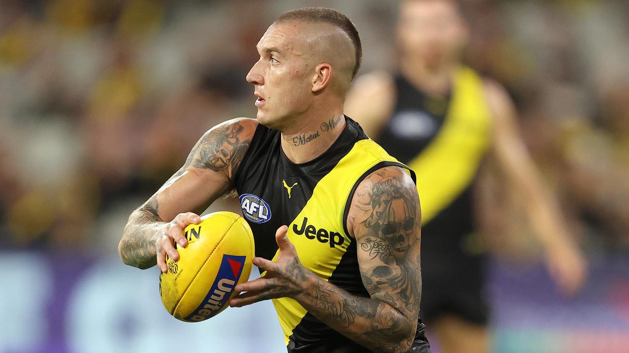 Richmond star Dustin Martin holds a match day ball with the United logo on it. Picture: Michael Klein