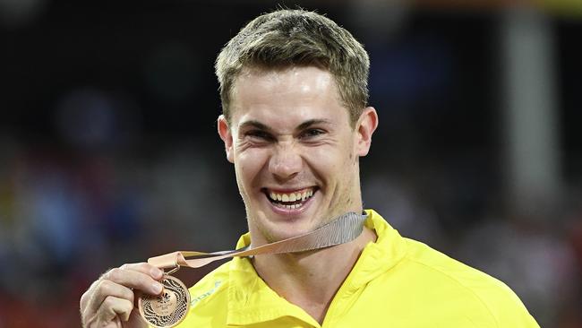 Nicholas Hough is all smiles with his 110m hurdles bronze medal. Photo: AAP