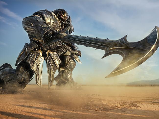 This image released by Paramount Pictures shows Megatron and Josh Duhamel as Lennox in a scene from, "Transformers: The Last Knight." (Paramount Pictures/Bay Films via AP)