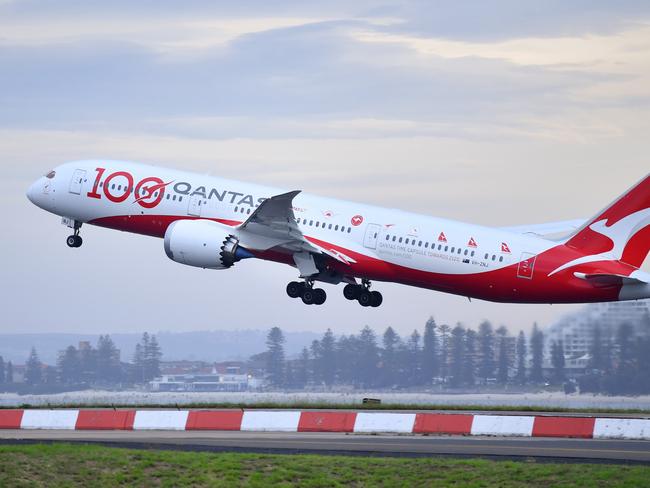 SYDNEY, AUSTRALIA - NOVEMBER 16: A Boeing 787 Dreamliner aircraft, Qantas flight QF100 takes off from Kingsford Smith International airport as part of Qantas 100th Birthday celebrations on November 16, 2020 in Sydney, Australia. Australia's national airline Qantas is celebrating 100 years. (Photo by James D. Morgan/Getty Images for Destination New South Wales/Qantas)