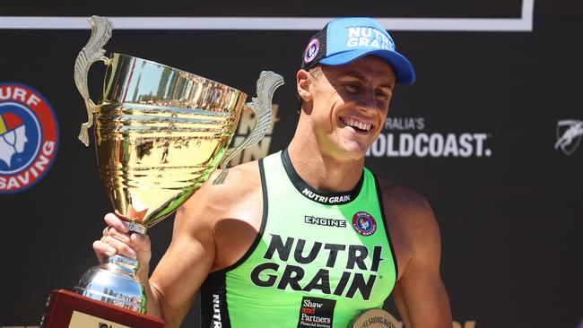 GOLD COAST, AUSTRALIA – FEBRUARY 05: Matt Bevilacqua holds the Series trophy after winning during round six of the Nutri-Grain IronMan at Kurrawa Beach on February 05, 2023 in Gold Coast, Australia. (Photo by Chris Hyde/Getty Images)