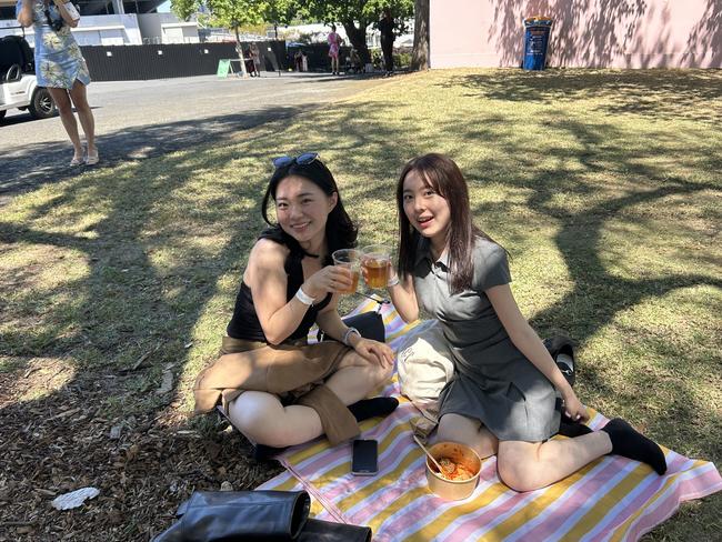 Renee Choi and Chiciro Tezuka enjoying the Melbourne Cup. Picture: Oscar Jaeger