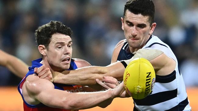 Lachie Neale battles with Mark O’Connor. Picture: Quinn Rooney/Getty Images