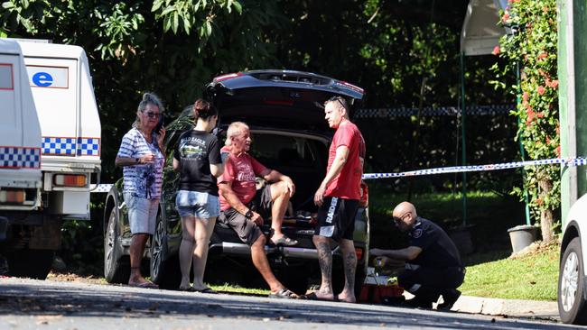 Relatives of the deceased man speak to police at the scene. Picture: Brendan Radke