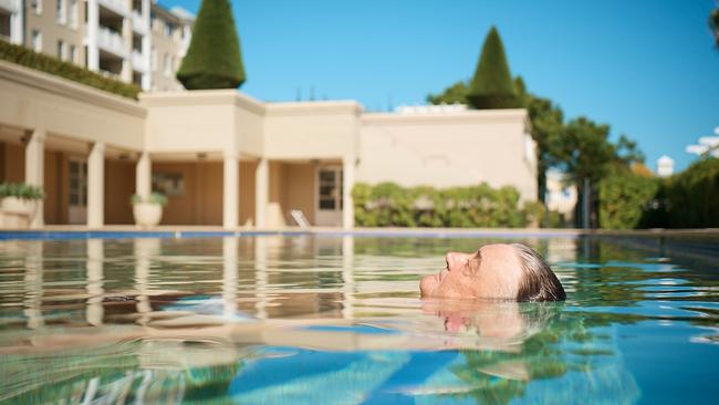 Hotels tycoon Arthur Laundy enjoys a dip in his pool on the Parramatta River in Sydney’s west, where he likes to swim 10 laps every day. Picture: Nic Walker