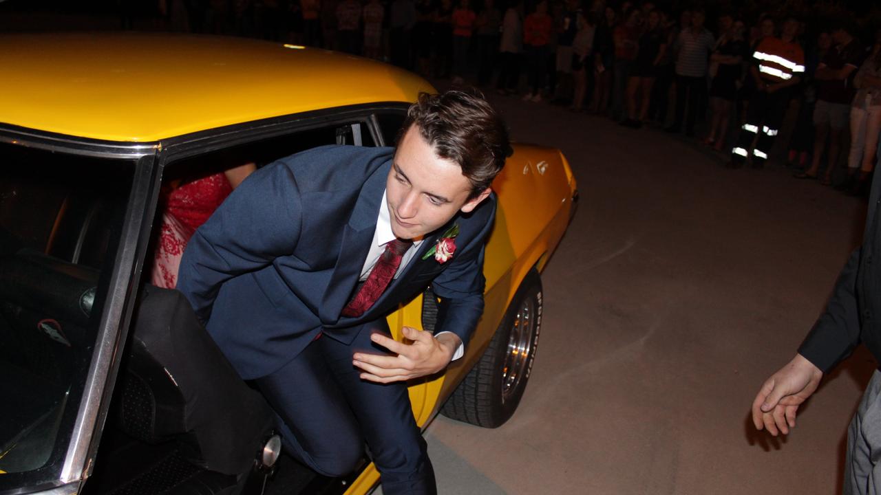 John Watkins hops out of his car at the St John's Formal at the Explorer's Inn in Roma.