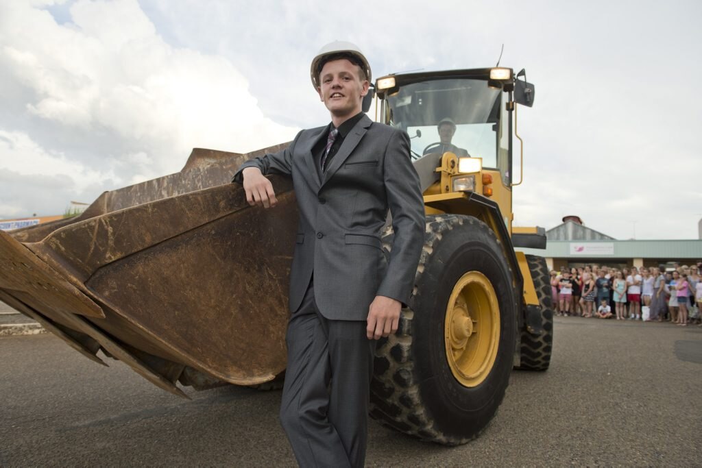 Isaac Wagner makes a grand entrance driven in a front end loader. Picture: Kevin Farmer