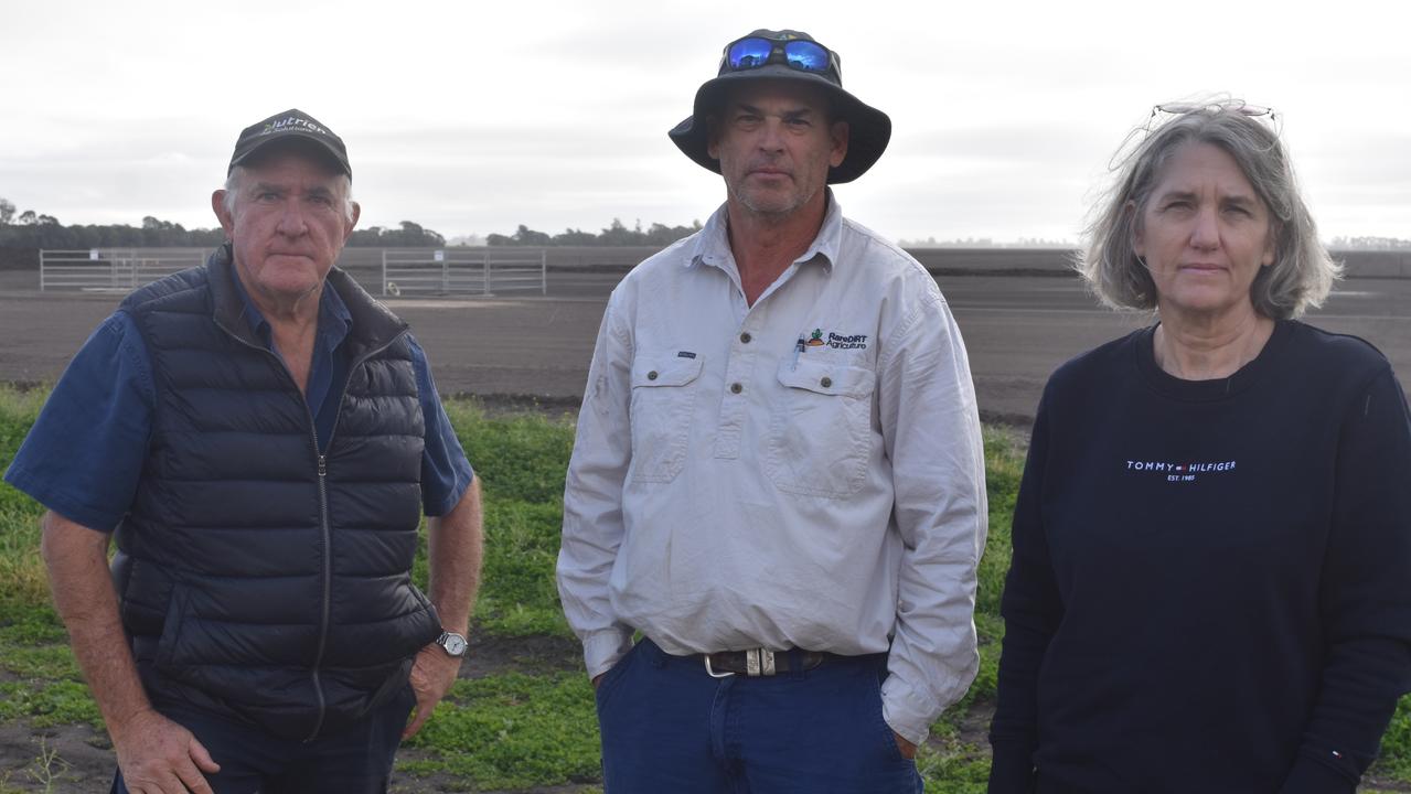 Kupunn property owners Wayne Newton, Mark Schuurs, and Zena Ronnfeldt in front of a deviated gas well. Picture: Sam Turner