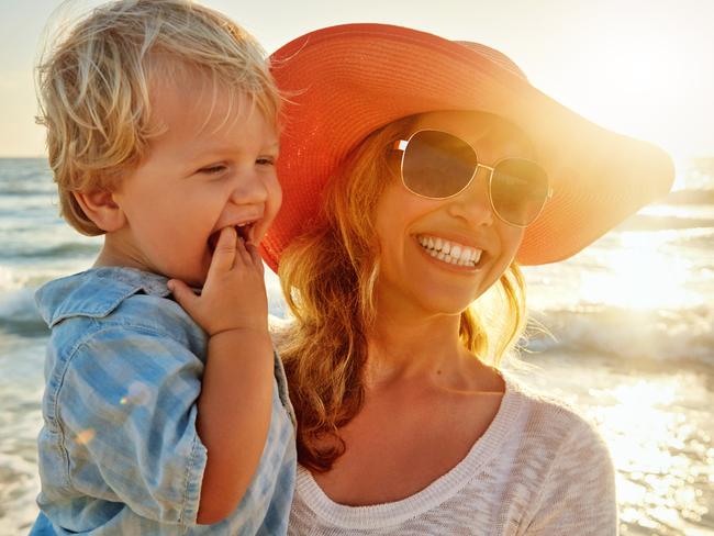 Shot of a young family enjoying a day at the beach