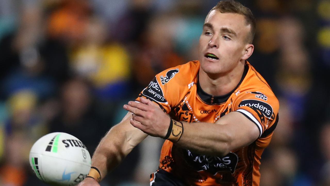 SYDNEY, AUSTRALIA - JULY 09: Jacob Liddle of the Tigers passes during the round 17 NRL match between the Wests Tigers and the Parramatta Eels at Leichhardt Oval on July 09, 2022 in Sydney, Australia. (Photo by Jason McCawley/Getty Images)