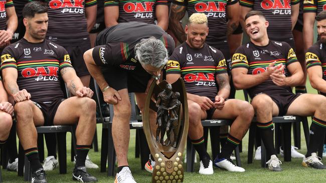 Ivan Cleary inspects the NRL premiership trophy on Sunday. Picture: Brett Costello