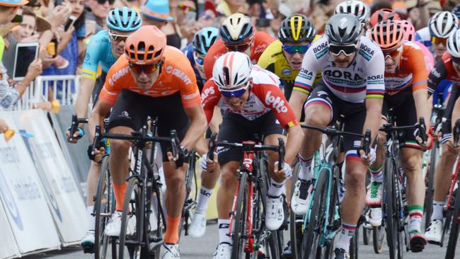 Race winner and new leader Patrick Bevin (L) from New Zealand of CCC Team crosses the finish in the Barossa Valley during stage two of the Tour Down Under cycling race in Adelaide on January 16, 2019. Picture: Brenton Edwards/AFP.