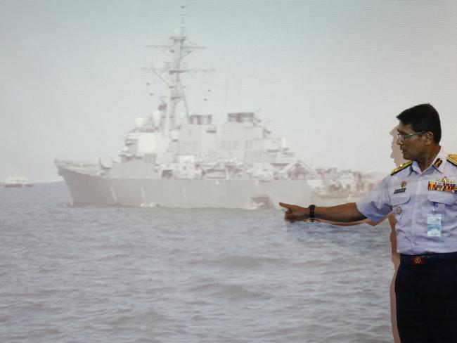 Malaysian Maritime Director Indera Abu Bakar points the damage of USS John S. McCain shown on a screen during a press conference in Putrajaya, Malaysia. Picture: AP