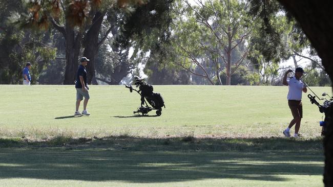 Golfers at the Victorian club where a man died after he was hit in the head by a ball. Picture: David Crosling