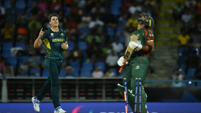 Pat Cummins entered the record books with a T20 World Cup hat trick. (Photo by ANDREW CABALLERO-REYNOLDS / AFP)