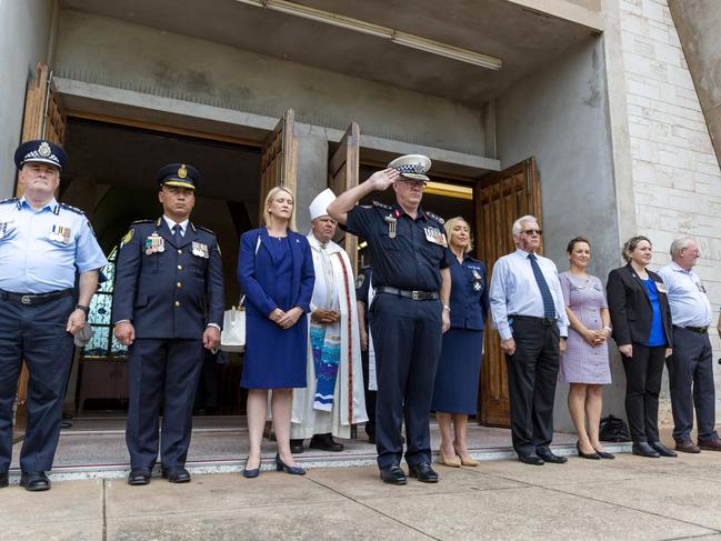 NT Police Commissioner Jamie Chalker salutes outside of St Mary’s Star of the Sea Cathedral after the march. Picture: Floss Adams.