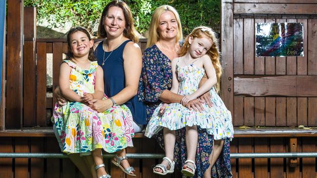 Single mums Melissa Clark (left) and Belinda Wilson with their five-year-old daughters Grace and Layla who were conceived using donor sperm. The families have become friends since connecting on Facebook. Picture: Richard Walker