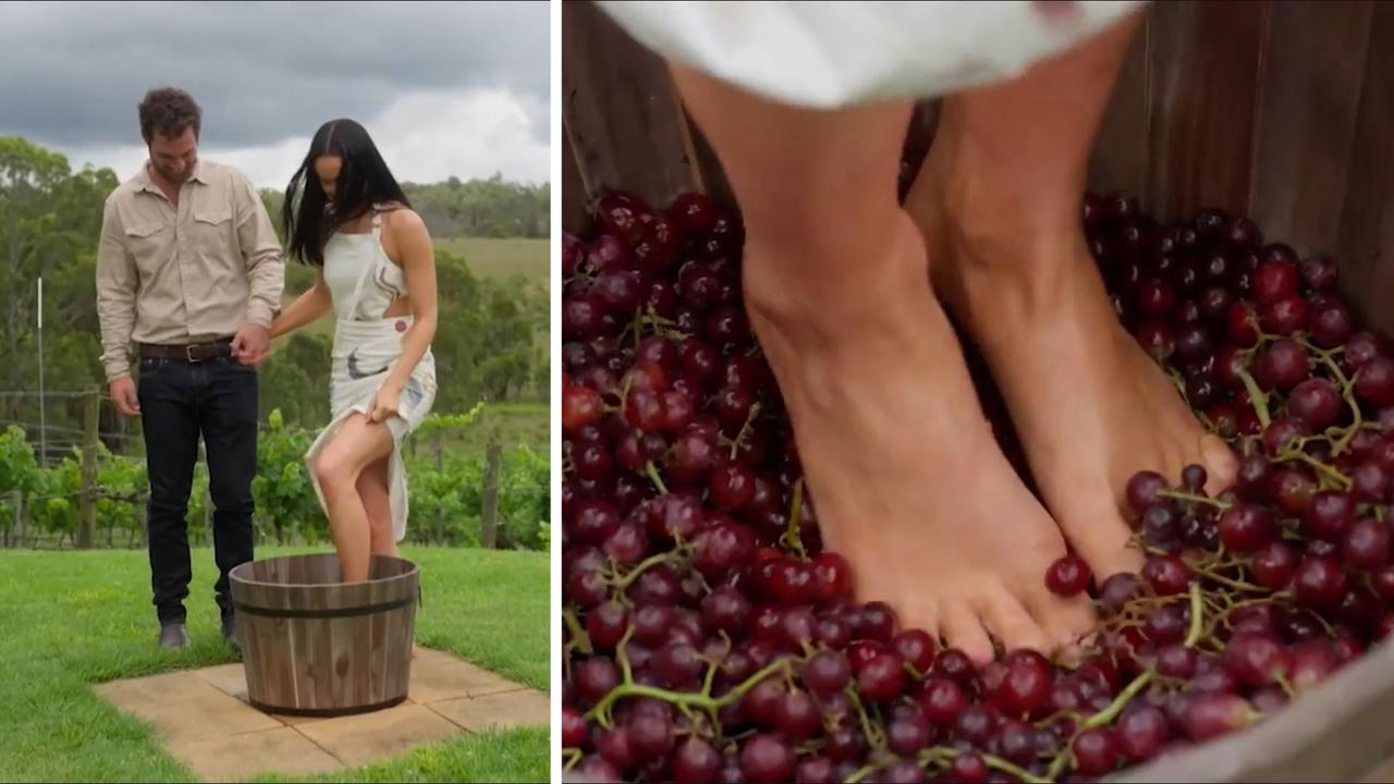 Karli’s imagining these grapes are Caitlin’s heart as she uses her feet to squish them to hell.